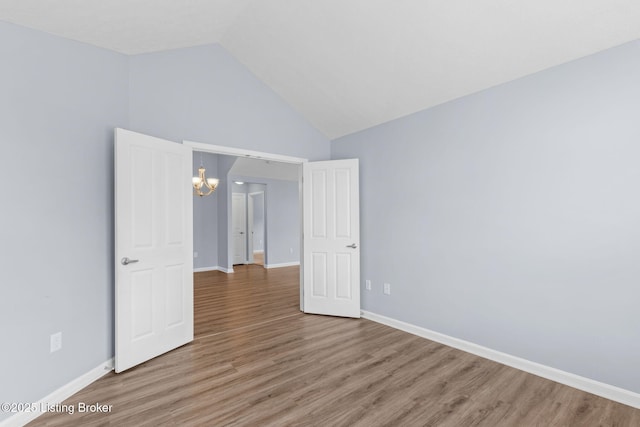 4331 Ivy Crest Cir, Louisville, KY 40241 - empty room featuring a chandelier, light wood-type flooring, and high vaulted ceiling