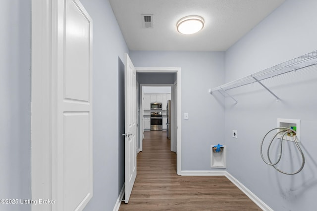 4331 Ivy Crest Cir, Louisville, KY 40241 - laundry area featuring hookup for a washing machine and wood finished floors
