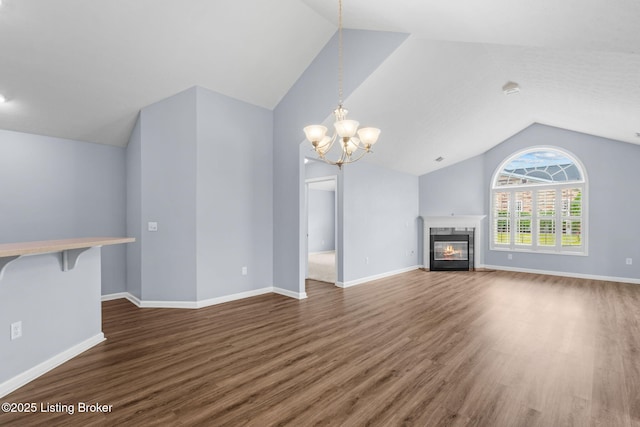 4331 Ivy Crest Cir, Louisville, KY 40241 - unfurnished living room featuring lofted ceiling, wood finished floors, a glass covered fireplace, and a chandelier