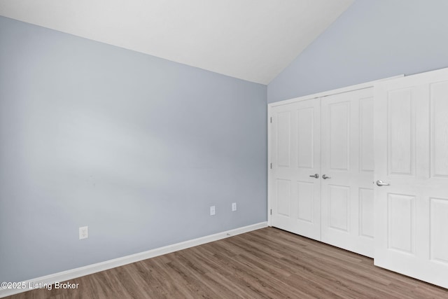 4331 Ivy Crest Cir, Louisville, KY 40241 - unfurnished bedroom with wood finished floors, a closet, and lofted ceiling