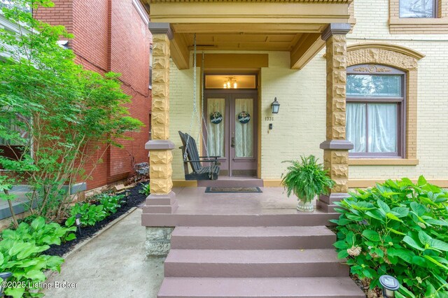 1331 Highland Ave, Louisville, KY 40204 - doorway to property featuring brick siding and french doors