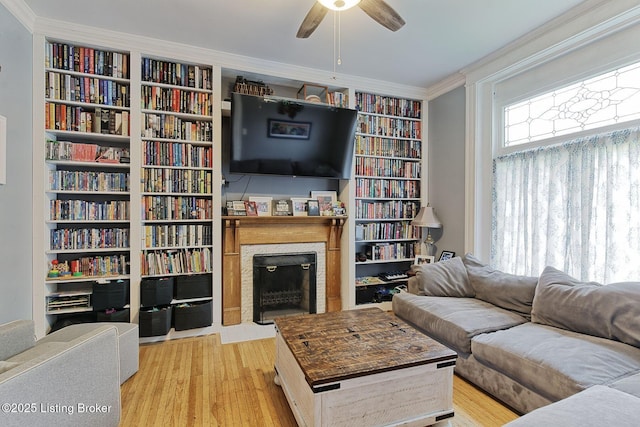 1331 Highland Ave, Louisville, KY 40204 - living area featuring a ceiling fan, a fireplace, ornamental molding, and light wood-style floors