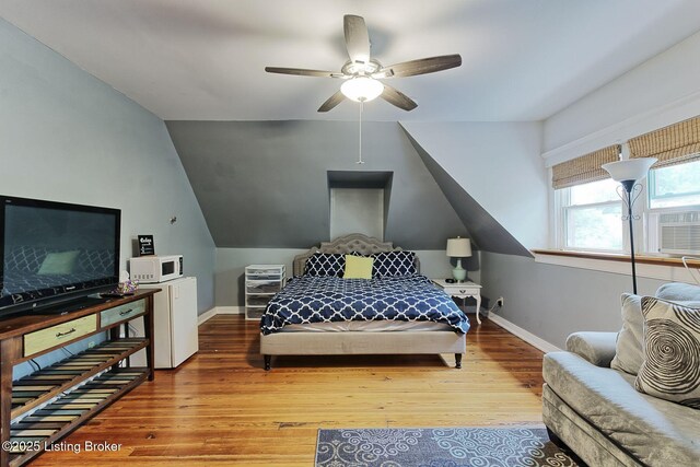 1331 Highland Ave, Louisville, KY 40204 - bedroom with wood finished floors, vaulted ceiling, and ceiling fan