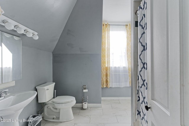 1331 Highland Ave, Louisville, KY 40204 - full bath with marble look tiles, a shower with curtain, and lofted ceiling