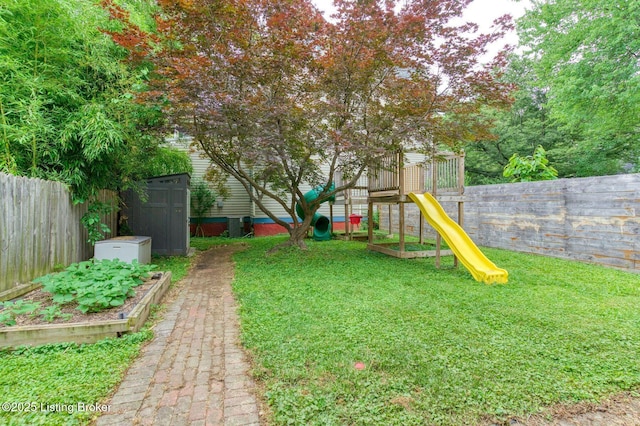 1331 Highland Ave, Louisville, KY 40204 - fenced backyard featuring a storage unit and a playground
