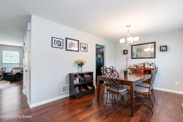 17804 Birch Bend Cir, Fisherville, KY 40023 - dining area featuring a chandelier and dark wood-style flooring