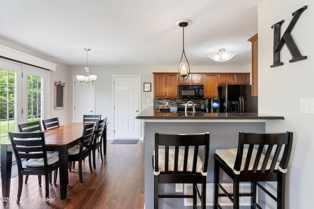 17804 Birch Bend Cir, Fisherville, KY 40023 - dining space with a chandelier and dark wood-type flooring