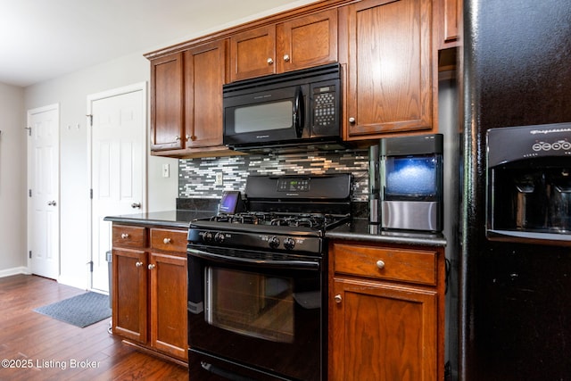 17804 Birch Bend Cir, Fisherville, KY 40023 - kitchen with black appliances, dark wood-style flooring, dark countertops, decorative backsplash, and brown cabinets