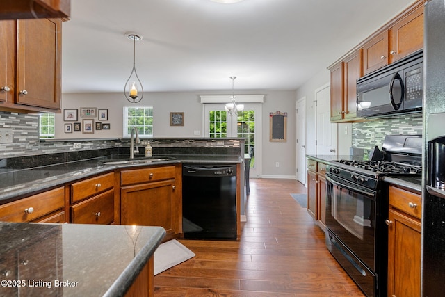 17804 Birch Bend Cir, Fisherville, KY 40023 - kitchen featuring black appliances, brown cabinetry, backsplash, and dark wood-style flooring