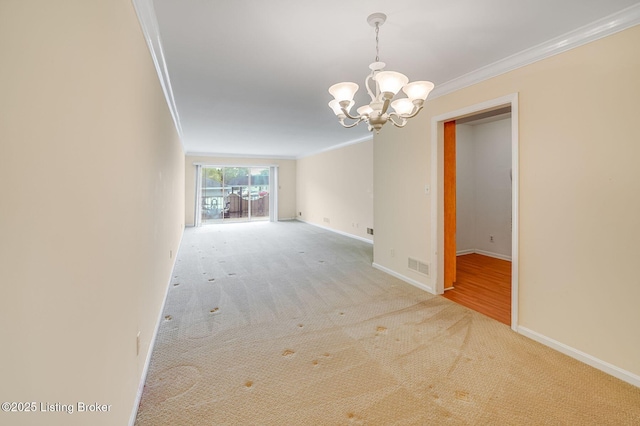 161 Thierman Ln Apt 1E, Louisville, KY 40207 - unfurnished room with ornamental molding, a chandelier, and carpet flooring