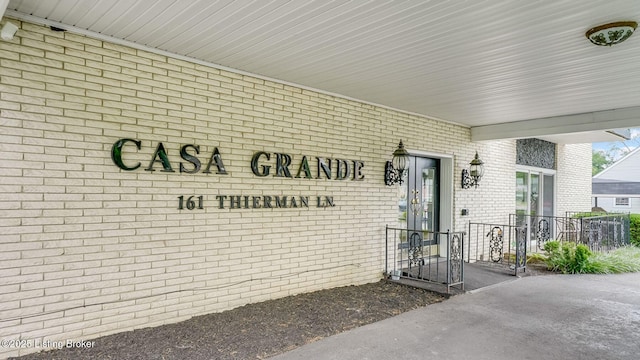 161 Thierman Ln Apt 1E, Louisville, KY 40207 - view of exterior entry featuring brick siding