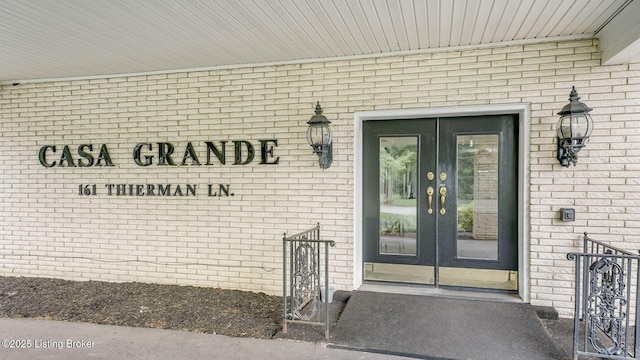 161 Thierman Ln Apt 1E, Louisville, KY 40207 - property entrance featuring french doors and brick siding