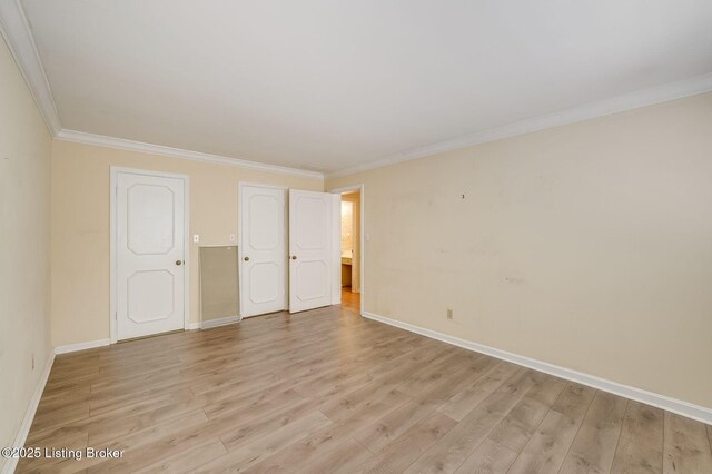 161 Thierman Ln Apt 1E, Louisville, KY 40207 - unfurnished bedroom with light wood-type flooring and ornamental molding