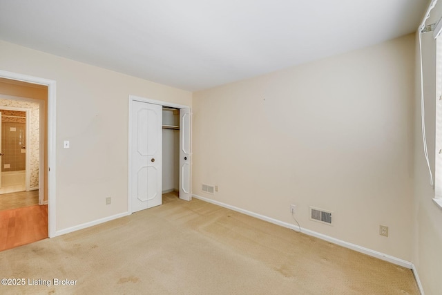 161 Thierman Ln Apt 1E, Louisville, KY 40207 - unfurnished bedroom with light carpet and a closet