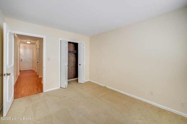 161 Thierman Ln Apt 1E, Louisville, KY 40207 - unfurnished bedroom featuring light colored carpet and a closet