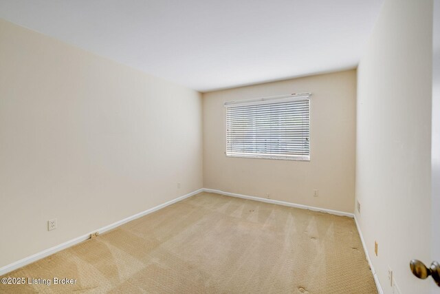 161 Thierman Ln Apt 1E, Louisville, KY 40207 - carpeted spare room featuring baseboards