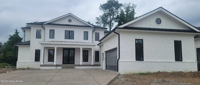 6513 Rosecliff Ct, Prospect, KY 40059 - view of front facade with concrete driveway, a garage, a porch, and board and batten siding