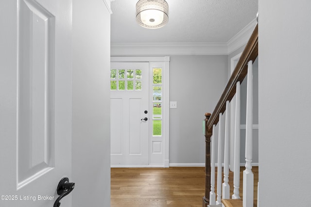 1908 Landing Rd, Prospect, KY 40059 - foyer entrance featuring ornamental molding, wood finished floors, stairs, and a textured ceiling