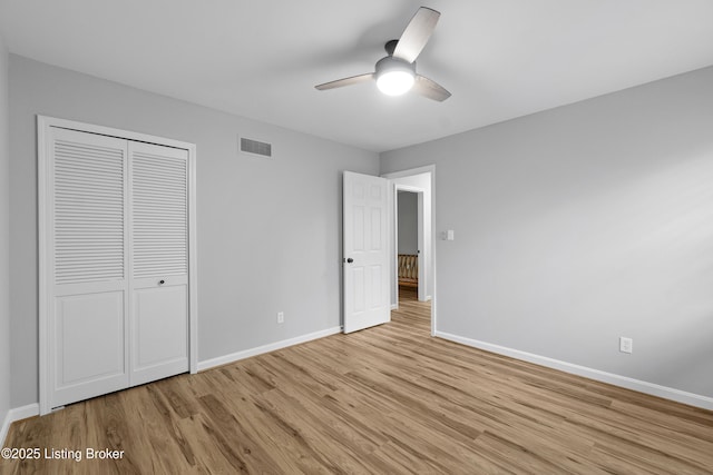1908 Landing Rd, Prospect, KY 40059 - unfurnished bedroom with light wood-style flooring, a closet, and a ceiling fan