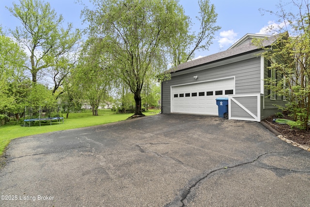 1908 Landing Rd, Prospect, KY 40059 - garage featuring a trampoline and asphalt driveway
