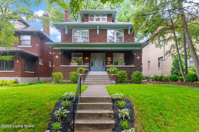 2144 Baringer Ave, Louisville, KY 40204 - american foursquare style home with covered porch, brick siding, a front lawn, and stairs