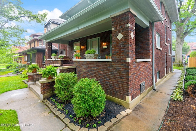 2144 Baringer Ave, Louisville, KY 40204 - view of home's exterior featuring brick siding and a porch