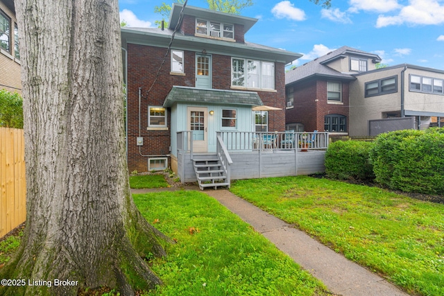 2144 Baringer Ave, Louisville, KY 40204 - view of front facade with brick siding and a wooden deck