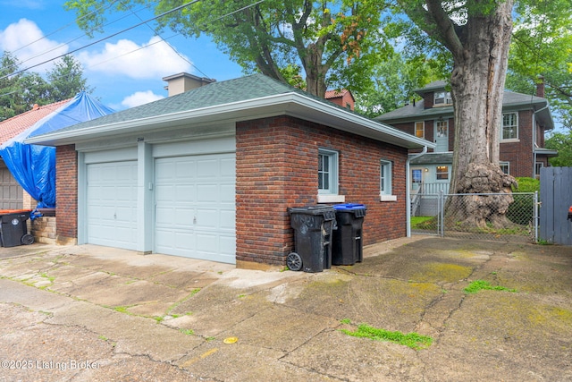 2144 Baringer Ave, Louisville, KY 40204 - view of property exterior featuring brick siding, driveway, a chimney, and a shingled roof