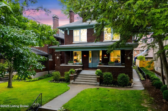 2144 Baringer Ave, Louisville, KY 40204 - american foursquare style home featuring covered porch, brick siding, and stairs