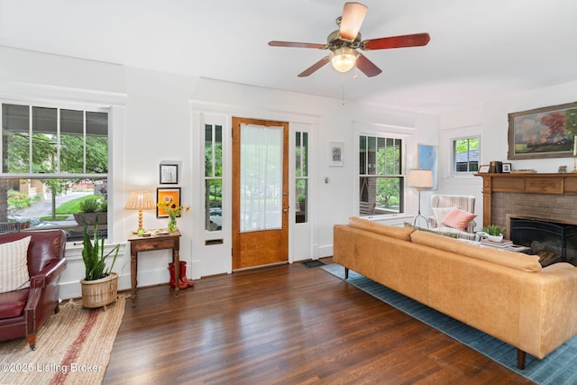2144 Baringer Ave, Louisville, KY 40204 - living area with wood finished floors, a ceiling fan, and a brick fireplace