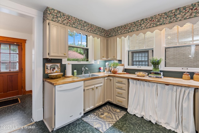 2144 Baringer Ave, Louisville, KY 40204 - kitchen featuring white dishwasher, wood counters, dark floors, and cream cabinetry