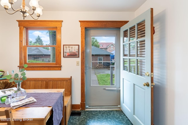 2144 Baringer Ave, Louisville, KY 40204 - doorway to outside with a chandelier and dark flooring