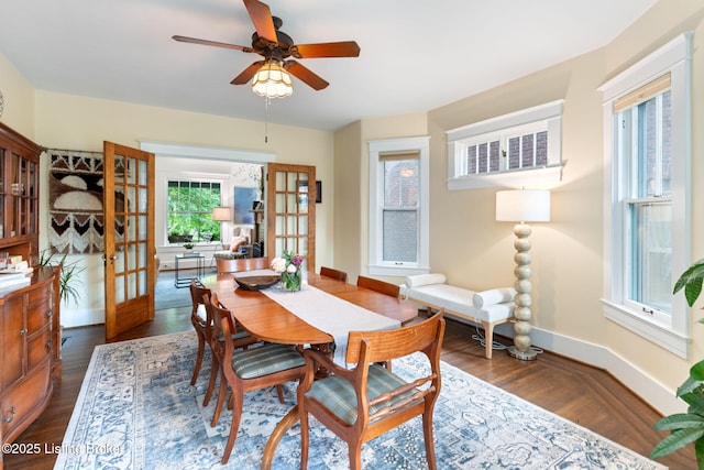 2144 Baringer Ave, Louisville, KY 40204 - dining room with dark wood-type flooring and ceiling fan