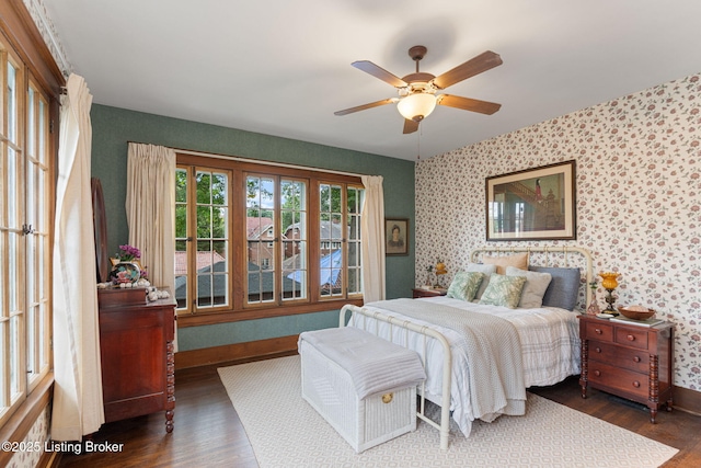 2144 Baringer Ave, Louisville, KY 40204 - bedroom with wallpapered walls, wood finished floors, and a ceiling fan