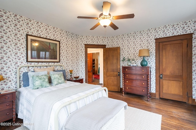 2144 Baringer Ave, Louisville, KY 40204 - bedroom featuring wallpapered walls, wood finished floors, and ceiling fan