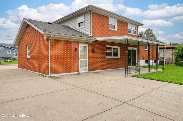 6218 Helenjean Way, Louisville, KY 40272 - back of property featuring brick siding, concrete driveway, and a shingled roof