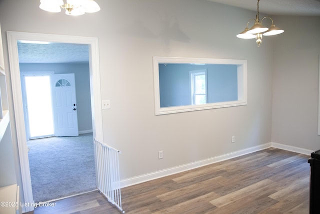 6099 Bloomfield Rd, Springfield, KY 40069 - spare room with a chandelier, healthy amount of natural light, and wood finished floors