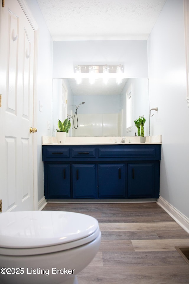 6099 Bloomfield Rd, Springfield, KY 40069 - full bath with vanity, wood finished floors, and a shower
