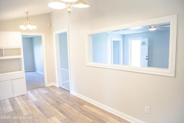 6099 Bloomfield Rd, Springfield, KY 40069 - unfurnished room featuring a chandelier, light wood finished floors, a ceiling fan, and lofted ceiling