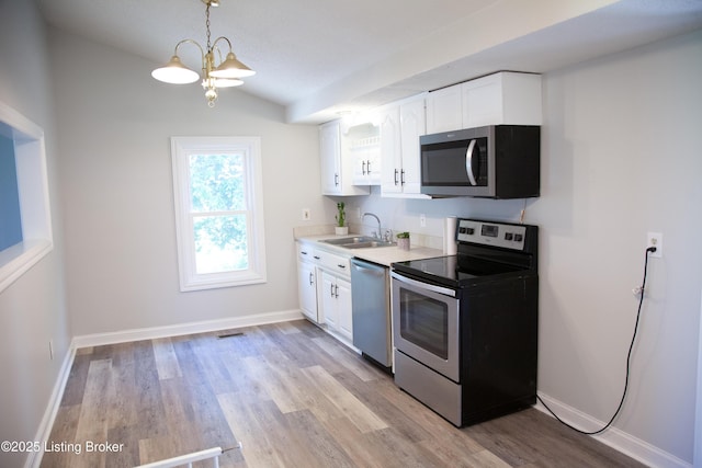 6099 Bloomfield Rd, Springfield, KY 40069 - kitchen with appliances with stainless steel finishes, white cabinets, light wood-type flooring, light countertops, and lofted ceiling