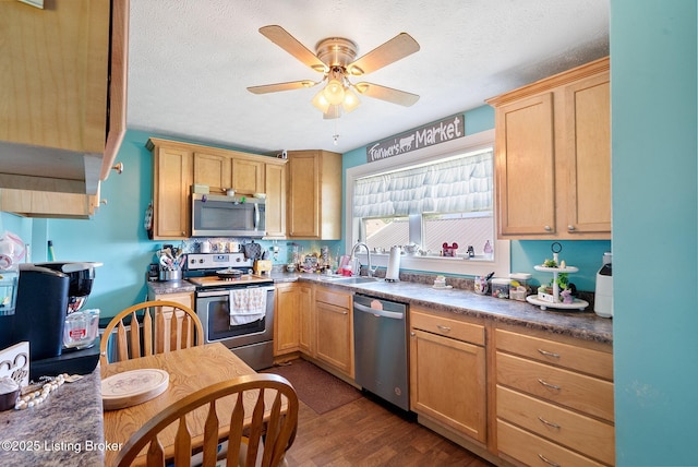 101 Bond St, Lawrenceburg, KY 40342 - kitchen featuring appliances with stainless steel finishes, dark wood-style floors, ceiling fan, a textured ceiling, and dark countertops