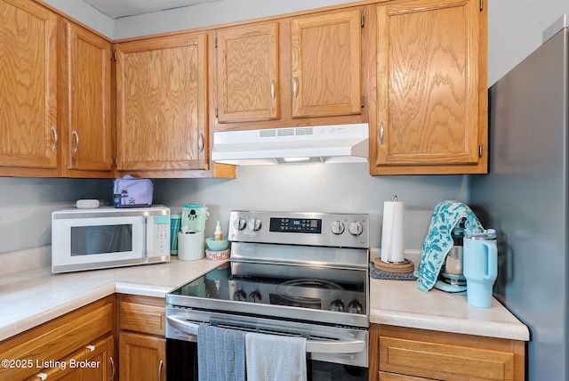 101 Bond St, Lawrenceburg, KY 40342 - kitchen with under cabinet range hood, appliances with stainless steel finishes, and light countertops