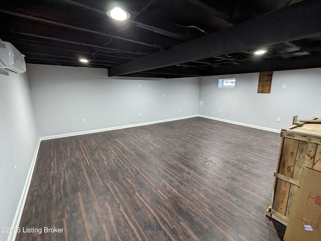 4100 Puppers Ct, Louisville, KY 40213 - below grade area featuring dark wood-style floors and a wall mounted AC