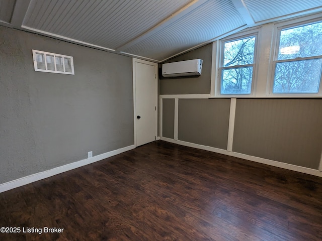 4100 Puppers Ct, Louisville, KY 40213 - additional living space with an AC wall unit, vaulted ceiling, and dark wood-style flooring