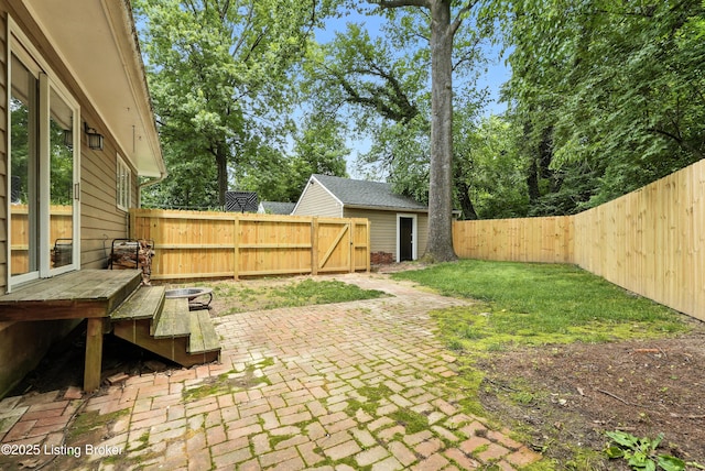 335 Ridgeway Ave, Louisville, KY 40207 - fenced backyard with a patio, an outbuilding, and a wooden deck