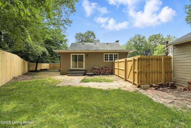 335 Ridgeway Ave, Louisville, KY 40207 - rear view of property featuring a fenced backyard, a chimney, and entry steps