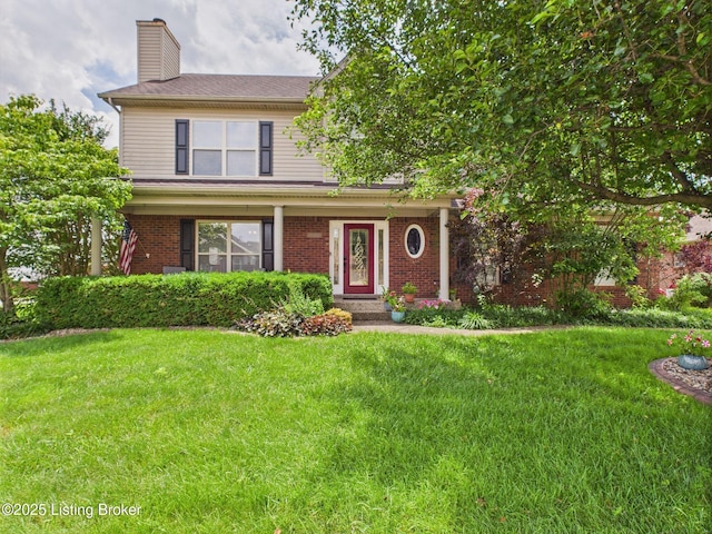 6408 Autumn Oak Way, Louisville, KY 40272 - view of front of home with a front yard, a chimney, and brick siding