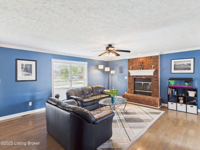 6408 Autumn Oak Way, Louisville, KY 40272 - living room with a ceiling fan, wood-type flooring, crown molding, a textured ceiling, and a brick fireplace