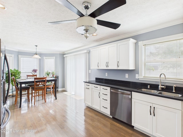 6408 Autumn Oak Way, Louisville, KY 40272 - kitchen with stainless steel appliances, crown molding, a textured ceiling, dark countertops, and a ceiling fan