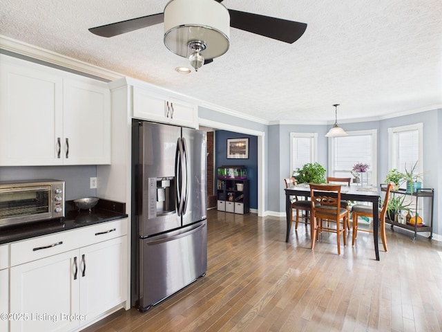 6408 Autumn Oak Way, Louisville, KY 40272 - kitchen featuring stainless steel fridge, ceiling fan, a textured ceiling, crown molding, and dark countertops